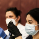 A pharmacist volunteer prepares doses of the Johnson and Johnson COVID-19 vaccine during a pop-up clinic at Western International High School on April 12, 2021 in Detroit, Michigan. The state of Michigan has seen an explosion of COVID-19 cases despite a massive effort to roll out vaccines. Pop-up clinics in various communities are one of the ways the state government is trying to get the surge under control.
